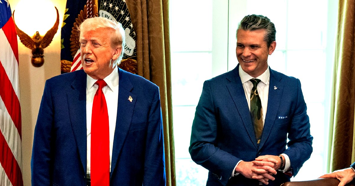 Donald Trump and a smiling associate stand together in a formal setting, with American flags and presidential seals in the background.