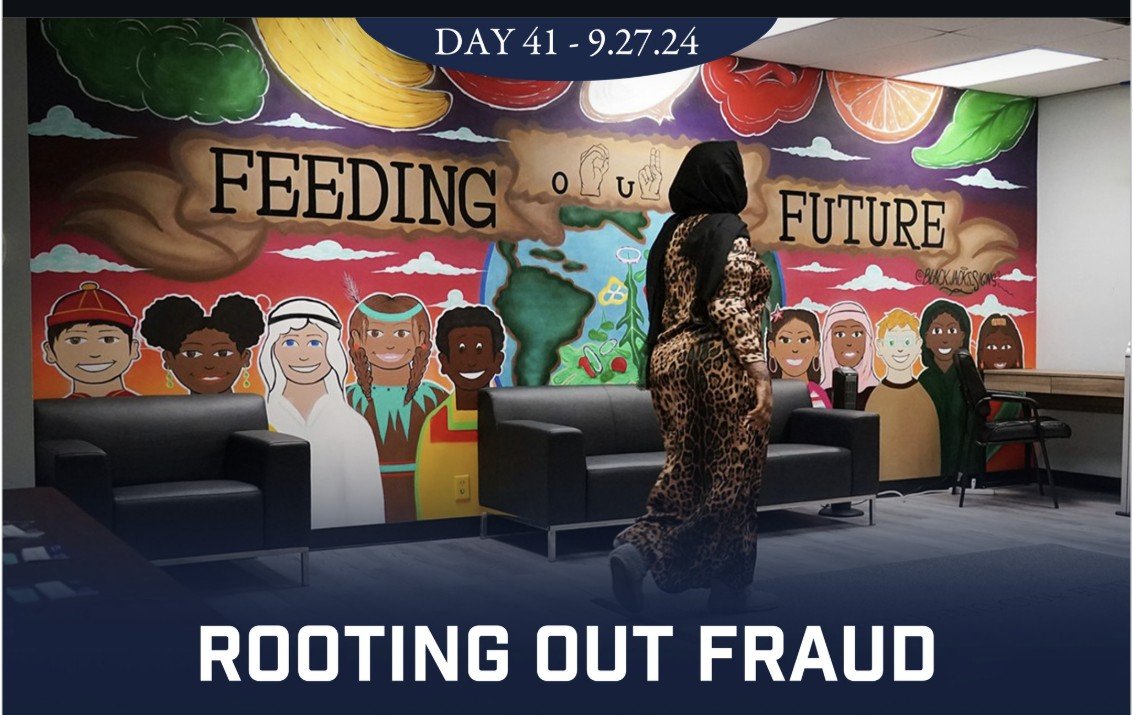 A woman in a patterned outfit stands in front of a colorful mural featuring diverse children and the text "Feeding Future," promoting community engagement and anti-fraud initiatives.