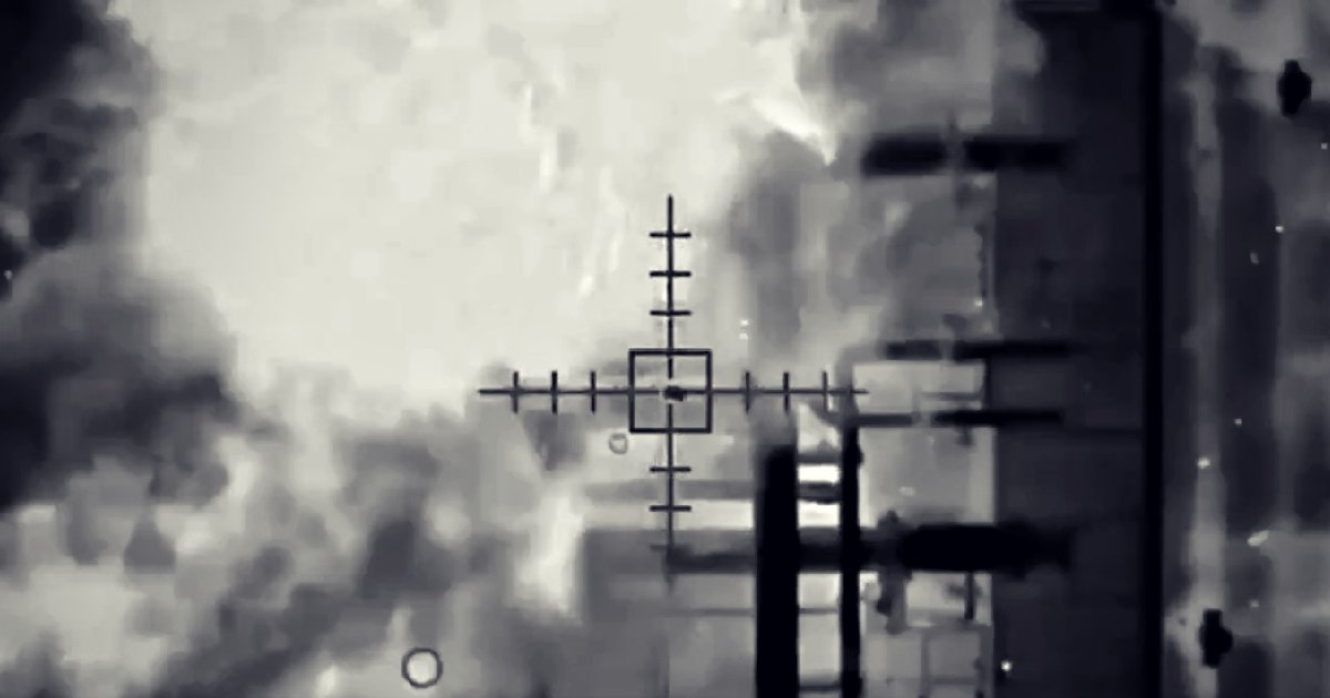Thermal imaging view through a targeting scope showing smoke and explosion effects in a military operation context.