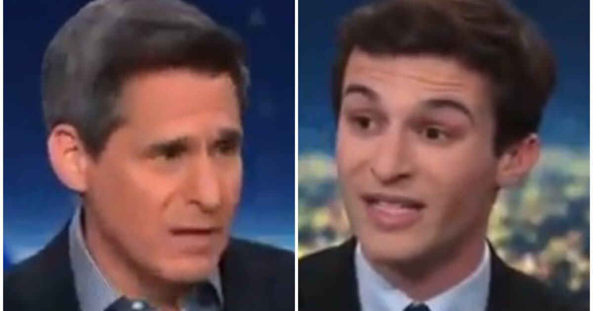 Two men engaged in a heated discussion during a televised interview, showcasing contrasting viewpoints and expressions.