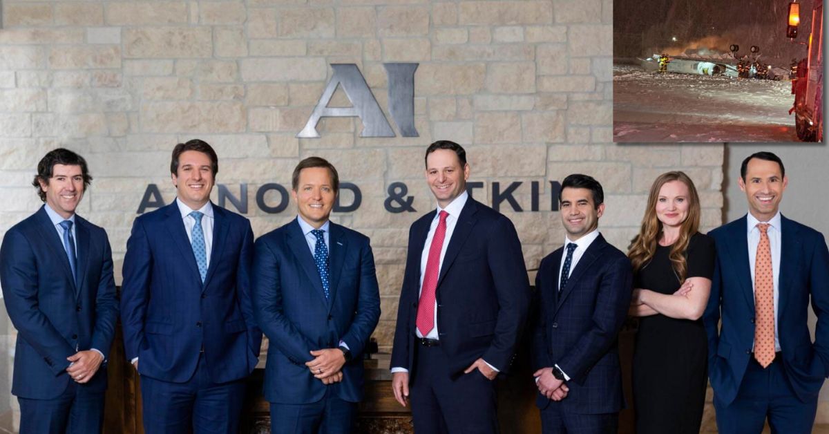 Professional team at Arnold & Itkin law firm poses for a group photo in front of their office, showcasing expertise in personal injury and accident cases.