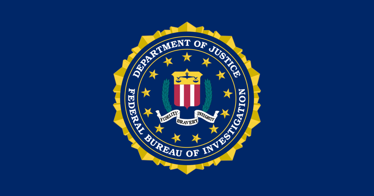 FBI seal featuring the words "Department of Justice," "Federal Bureau of Investigation," and symbols representing fidelity, bravery, and integrity on a blue background.