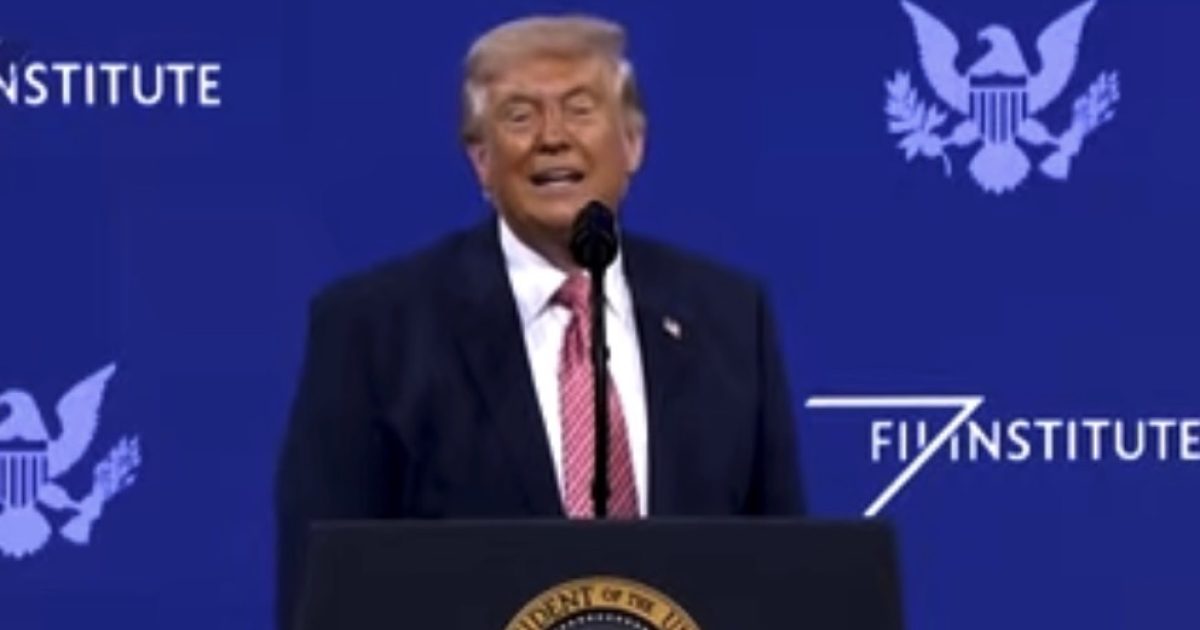 Donald Trump speaking at the FII Institute event, delivering remarks in front of an audience with the presidential seal visible.