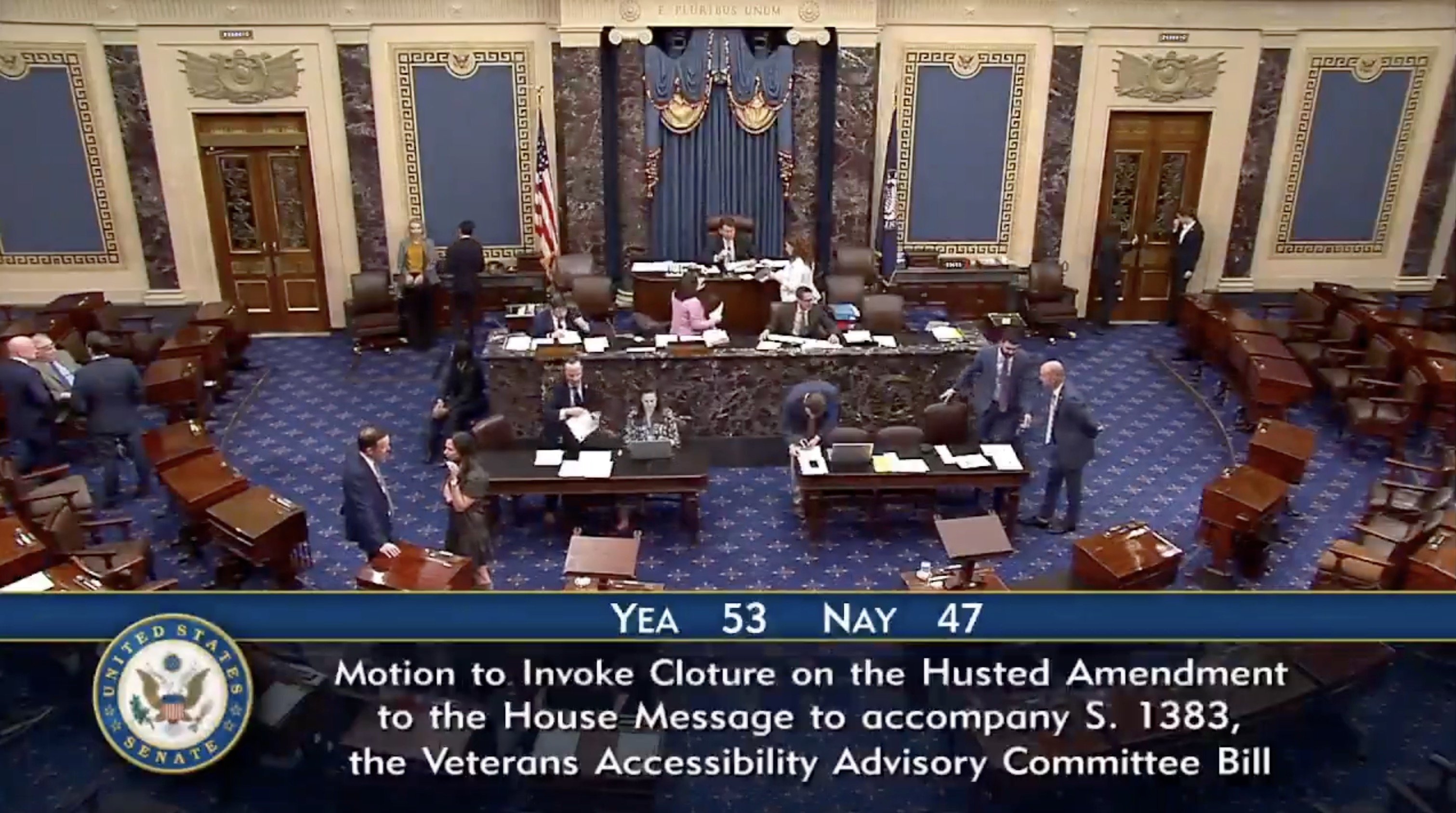 U.S. Senate chamber during a session discussing the Husted Amendment and Veterans Accessibility Advisory Committee Bill, with senators engaged in debate and voting activities.