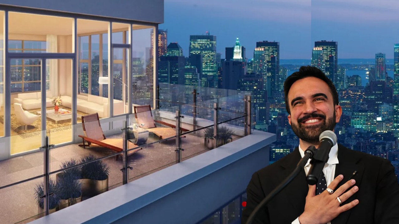 Luxury penthouse balcony with city skyline view, featuring modern furnishings and a smiling speaker at a microphone.