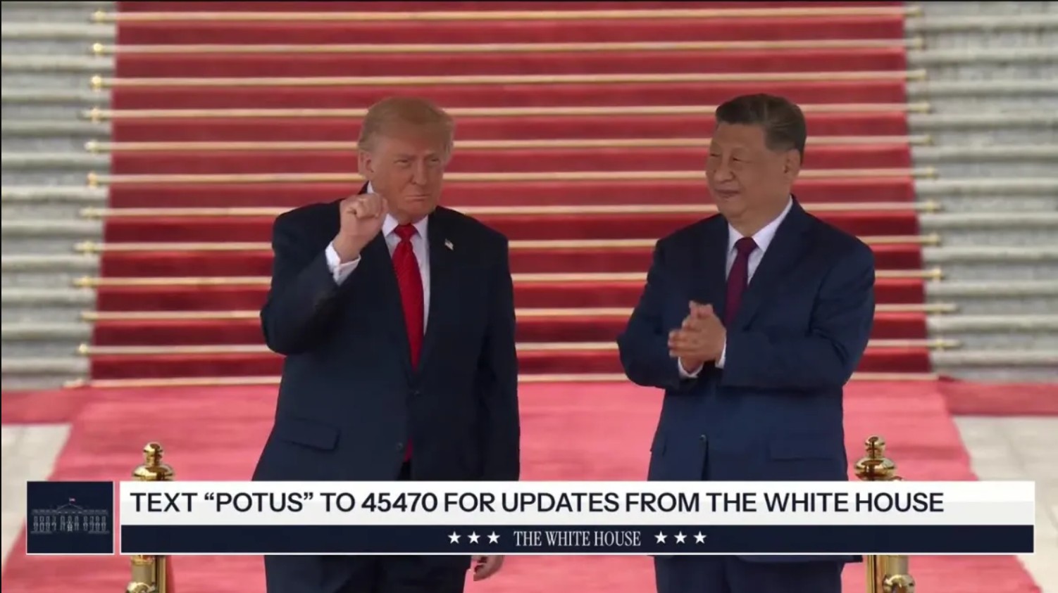 Former US President Donald Trump and Chinese President Xi Jinping stand together on a red carpet during a formal event, showcasing international diplomatic relations.