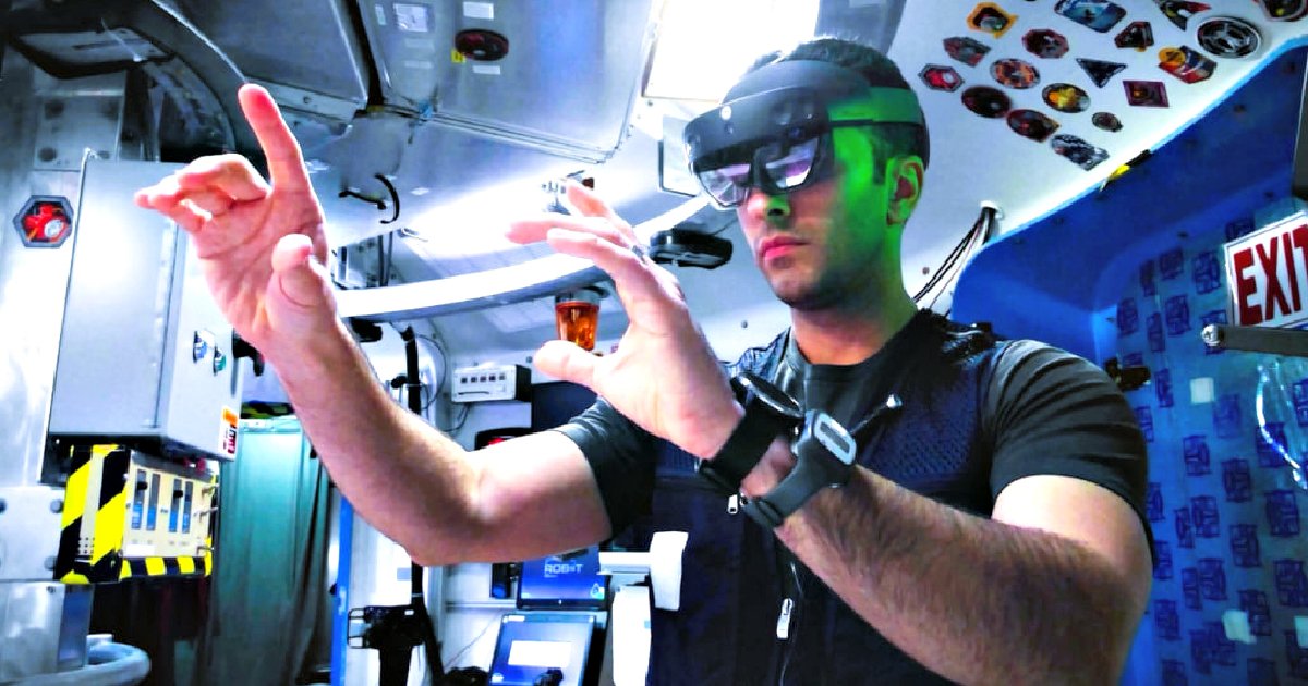 A man wearing augmented reality glasses interacts with virtual elements in a high-tech environment, showcasing advanced technology in action.